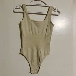 OQQ beige bodysuit, never worn.
